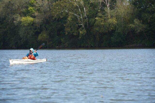 Man Kayaking On A River
