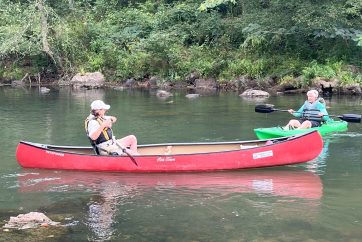 Friends Paddling In The Water