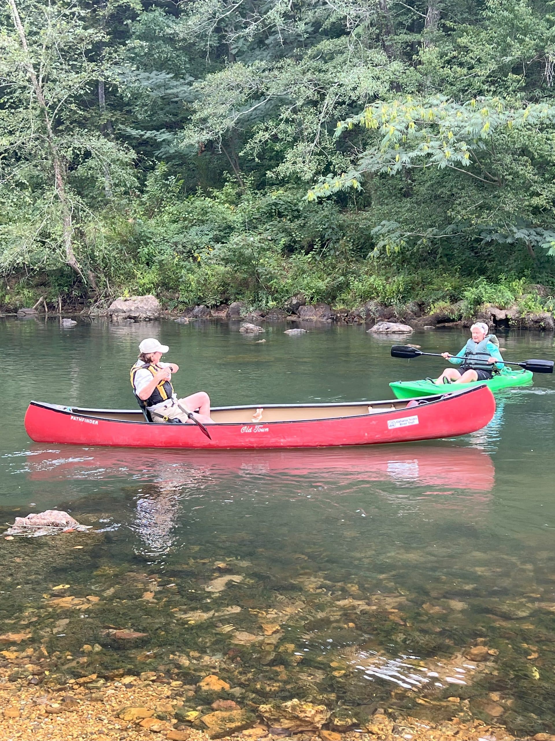 Friends paddling in the water