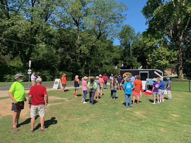 A Crowed Gathered At The Autauga Creek Mile Marker Handoff